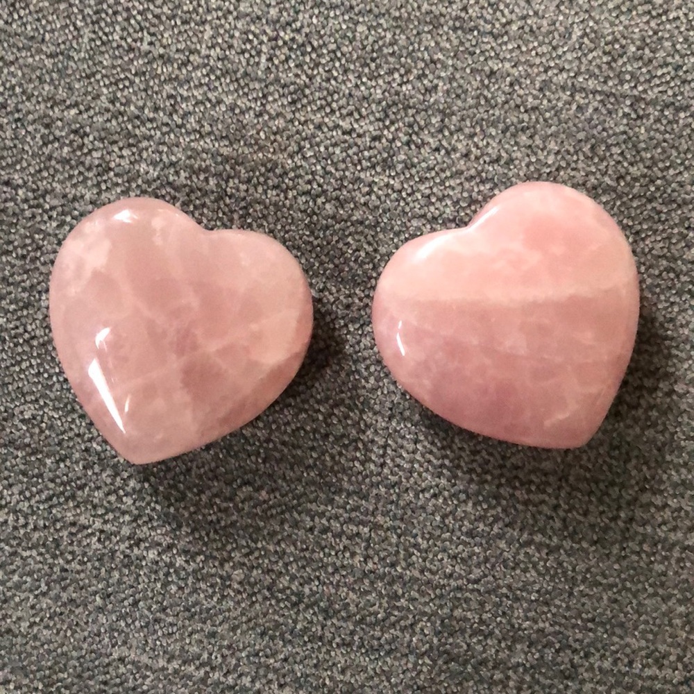 Two rose quartz hearts